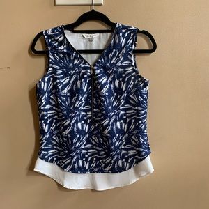 A zip up sleeveless top